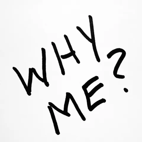 Handwritten black marker lettering asking WHY ME? tilted diagonally on a plain white background.
