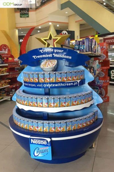 Round NestlΓ© All Purpose Cream promotional display with a star topper reading Create your Creamiest Handaan.