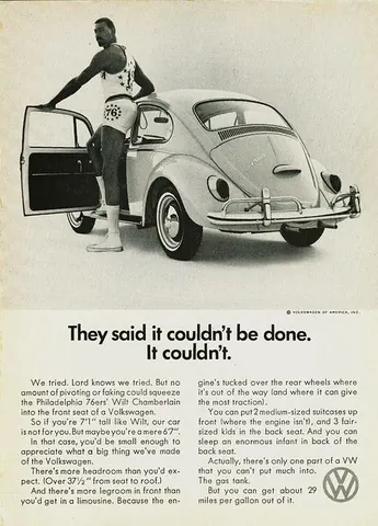 Basketball player in a number 76 jersey beside a Volkswagen Beetle in a vintage ad headlined They said it couldn't be done.