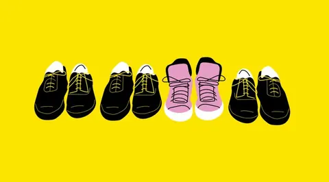 Illustration of five shoes in a row, one pink pair standing out among four black pairs