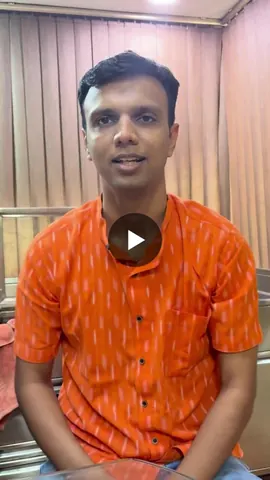A man in an orange printed shirt speaks to the camera in a video about the risks of cleaning ears with cotton buds.