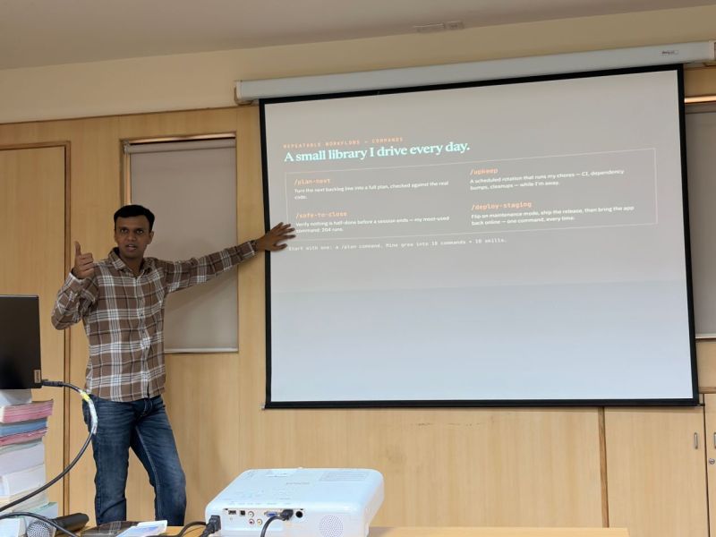 Gaurav gives a thumbs up while presenting a slide listing his personal workflow commands.